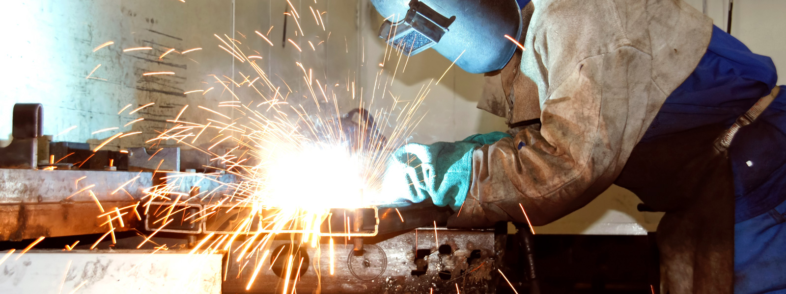 man welding with a welder